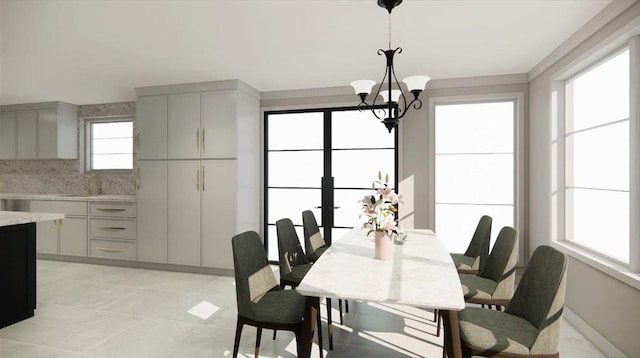 2 Henry St, Great Neck, NY 11023 - dining space featuring a chandelier
