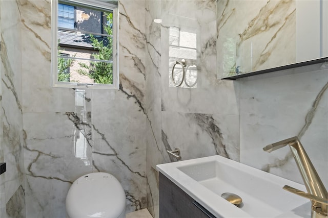 2 Henry St, Great Neck, NY 11023 - bathroom with plenty of natural light, tile walls, toilet, and vanity