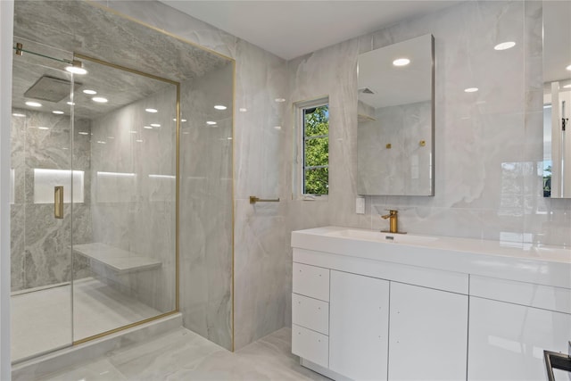 2 Henry St, Great Neck, NY 11023 - full bath with a marble finish shower, vanity, marble finish floors, and tile walls