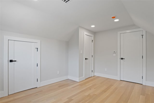 2 Henry St, Great Neck, NY 11023 - bonus room featuring lofted ceiling, light wood finished floors, baseboards, and recessed lighting