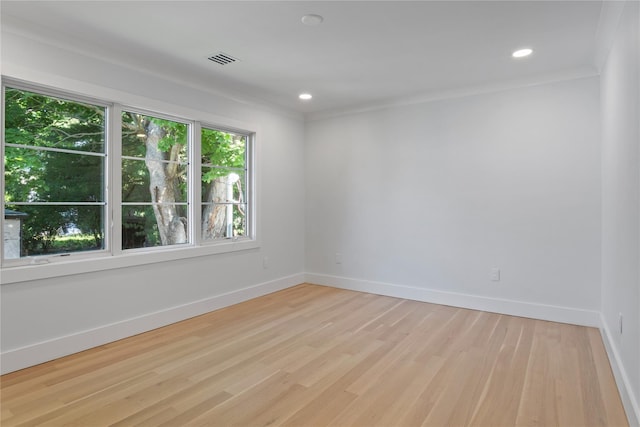 2 Henry St, Great Neck, NY 11023 - spare room with light wood-style flooring, baseboards, recessed lighting, and ornamental molding