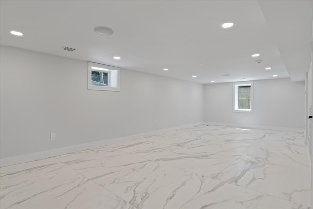 2 Henry St, Great Neck, NY 11023 - below grade area with recessed lighting, plenty of natural light, and baseboards