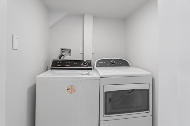 2 Henry St, Great Neck, NY 11023 - laundry room featuring washing machine and clothes dryer