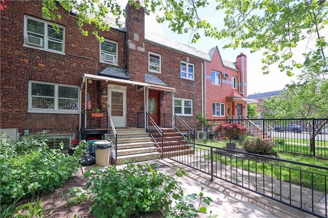 2179 E 26th St, Brooklyn, NY 11229 - view of property featuring brick siding and a chimney