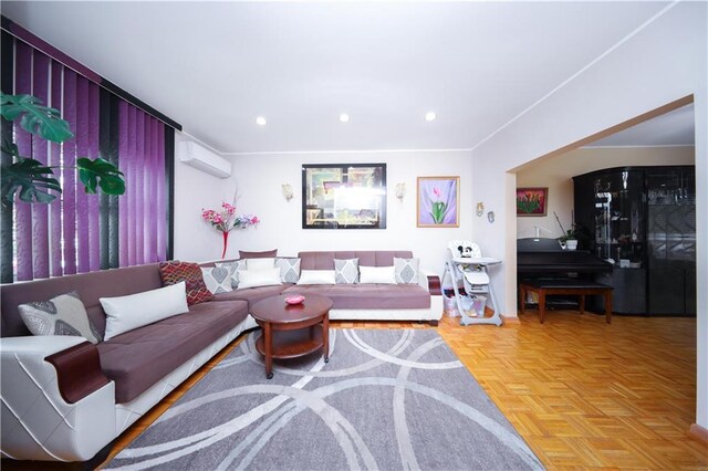 2179 E 26th St, Brooklyn, NY 11229 - living area with recessed lighting and an AC wall unit