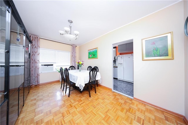 2179 E 26th St, Brooklyn, NY 11229 - dining space featuring baseboards, a chandelier, and cooling unit