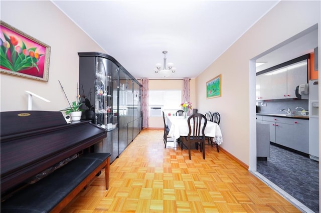 2179 E 26th St, Brooklyn, NY 11229 - dining area with a chandelier and baseboards