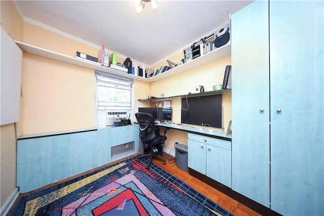 2179 E 26th St, Brooklyn, NY 11229 - office area featuring built in desk, baseboards, cooling unit, and dark wood-style flooring