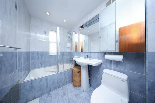 2179 E 26th St, Brooklyn, NY 11229 - full bath featuring tile walls, toilet, and tiled shower / bath