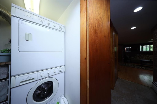 2179 E 26th St, Brooklyn, NY 11229 - laundry area featuring stacked washer / drying machine, recessed lighting, and tile patterned floors