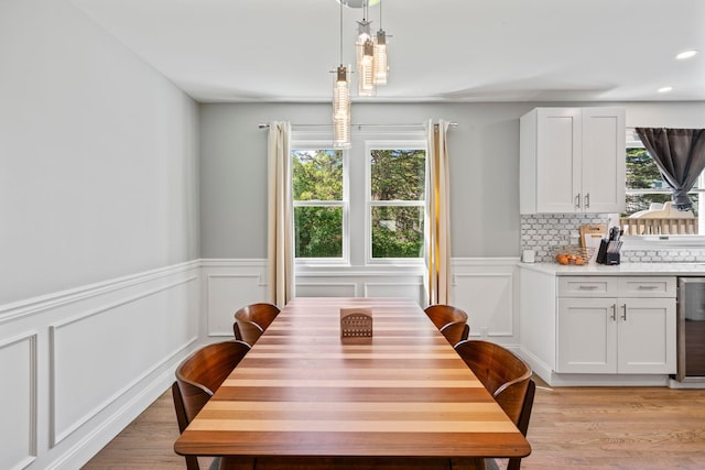 170 Lenox St, Port Jefferson Station, NY 11776 - dining area featuring light wood-type flooring, plenty of natural light, a wainscoted wall, recessed lighting, and a decorative wall