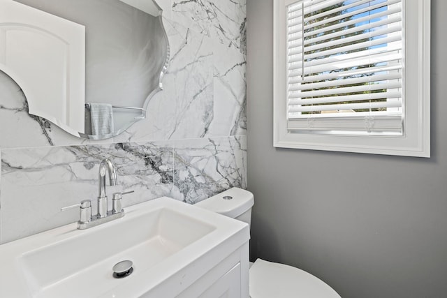 170 Lenox St, Port Jefferson Station, NY 11776 - half bathroom with toilet, tasteful backsplash, and vanity
