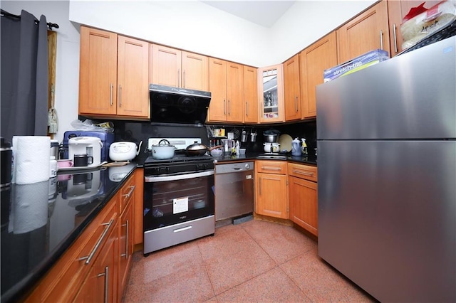 462 52nd St Unit 2D, Brooklyn, NY 11220 - kitchen with stainless steel appliances, dark speckled floor, exhaust hood, glass insert cabinets, and brown cabinetry