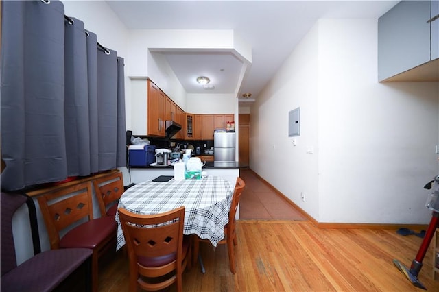 462 52nd St Unit 2D, Brooklyn, NY 11220 - dining space featuring electric panel, baseboards, and light wood-type flooring