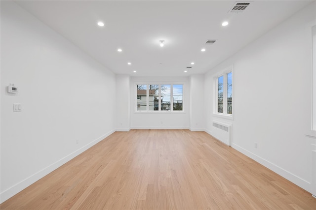 29 Calvert Dr Unit 211, Monsey, NY 10952 - unfurnished room featuring radiator heating unit, light wood-type flooring, recessed lighting, and baseboards