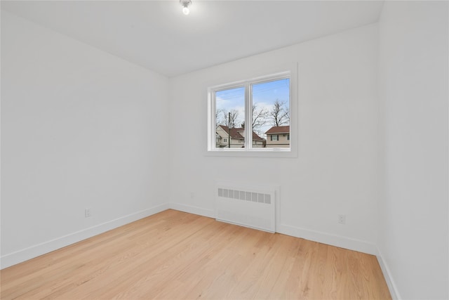 29 Calvert Dr Unit 211, Monsey, NY 10952 - unfurnished room with radiator, baseboards, and light wood finished floors