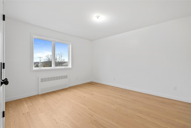 29 Calvert Dr Unit 211, Monsey, NY 10952 - unfurnished room featuring radiator heating unit, light wood finished floors, and baseboards