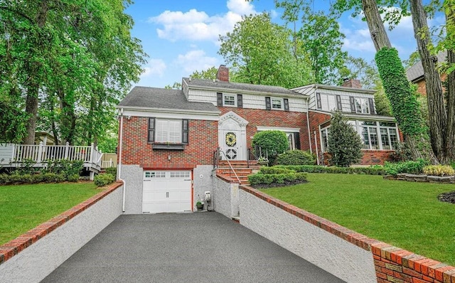 265 Lighthouse Ave, Staten Island, NY 10306 - view of front of home featuring brick siding, a chimney, asphalt driveway, a garage, and a front lawn