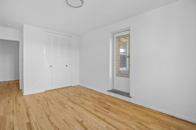 642 Locust St Unit 3K, Mount Vernon, NY 10552 - unfurnished bedroom with light wood-type flooring, a closet, and baseboards
