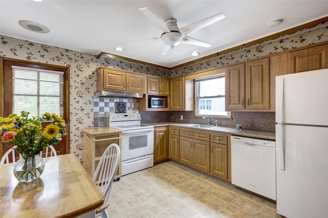 29 Newmarket Rd, Syosset, NY 11791 - kitchen with white appliances, a sink, under cabinet range hood, ceiling fan, and backsplash