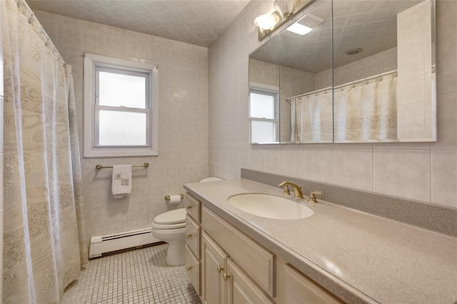 29 Newmarket Rd, Syosset, NY 11791 - bathroom featuring a baseboard heating unit, tile walls, toilet, vanity, and tile patterned floors