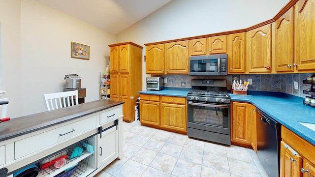 235 Panorama Ct, Poughkeepsie, NY 12603 - kitchen with stainless steel microwave, gas range oven, lofted ceiling, dishwasher, and decorative backsplash