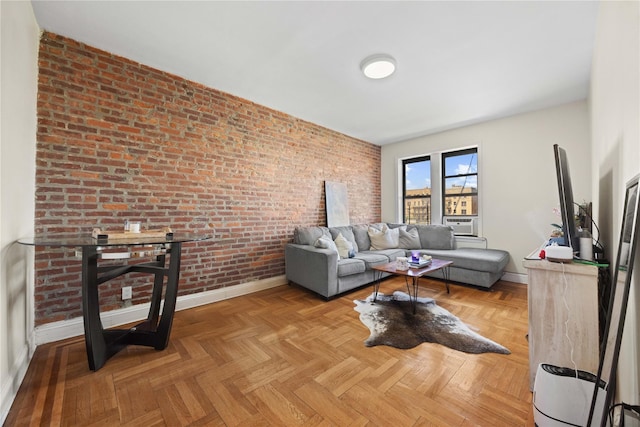 1372 Shakespeare Ave Unit 3A, Bronx, NY 10452 - living room featuring baseboards and brick wall
