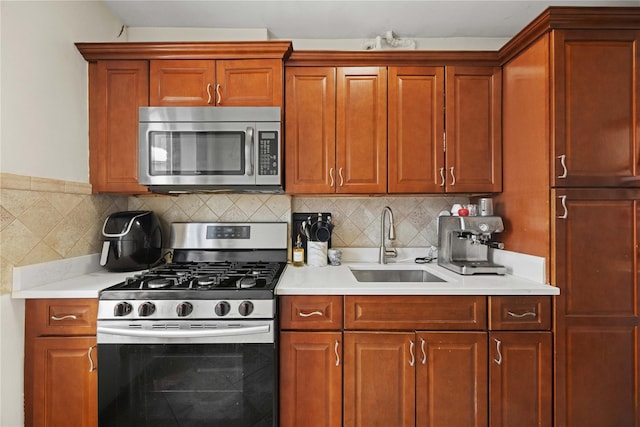 1372 Shakespeare Ave Unit 3A, Bronx, NY 10452 - kitchen with stainless steel appliances, a sink, light countertops, and tasteful backsplash