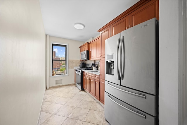 1372 Shakespeare Ave Unit 3A, Bronx, NY 10452 - kitchen with appliances with stainless steel finishes, a sink, and brown cabinets