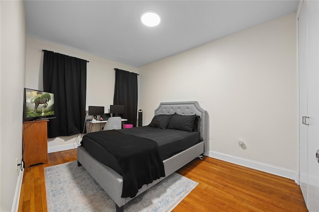 1372 Shakespeare Ave Unit 3A, Bronx, NY 10452 - bedroom featuring baseboards and wood finished floors