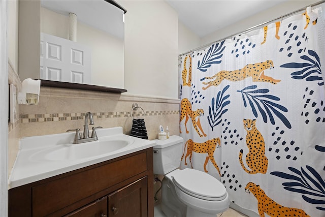1372 Shakespeare Ave Unit 3A, Bronx, NY 10452 - full bathroom with vanity, toilet, wainscoting, curtained shower, and tile walls