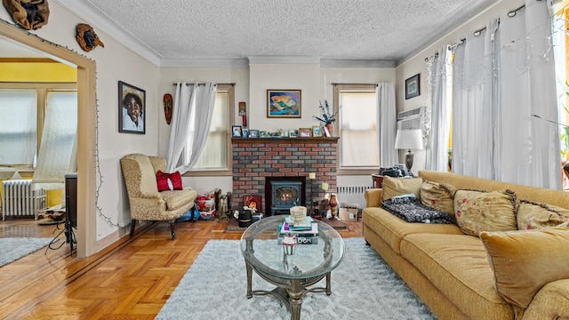 82-60 166th St, Jamaica, NY 11432 - living area featuring radiator heating unit, plenty of natural light, a textured ceiling, a fireplace, and crown molding