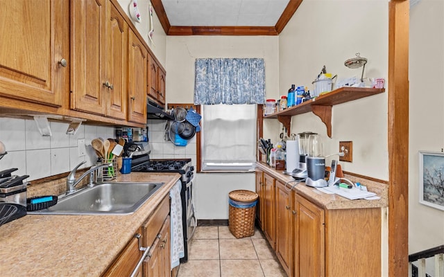 82-60 166th St, Jamaica, NY 11432 - kitchen with gas stove, a sink, crown molding, brown cabinetry, and backsplash