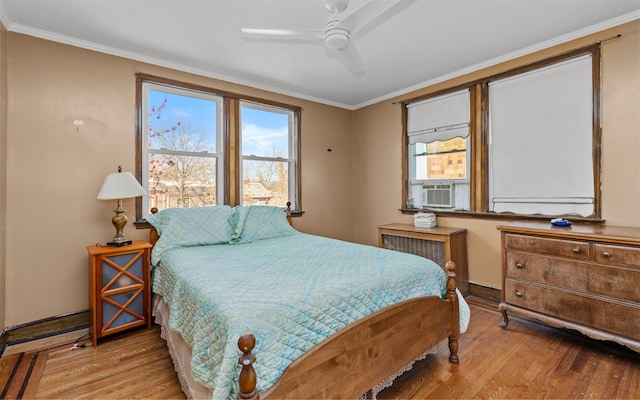 82-60 166th St, Jamaica, NY 11432 - bedroom featuring wood finished floors, crown molding, baseboards, and ceiling fan