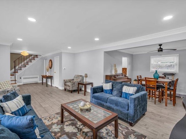 38 Nadine Ln, Port Jefferson Station, NY 11776 - living room with radiator heating unit, crown molding, light wood finished floors, recessed lighting, and stairway
