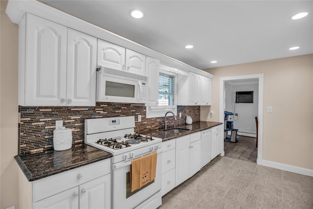 38 Nadine Ln, Port Jefferson Station, NY 11776 - kitchen featuring white appliances, a sink, white cabinetry, backsplash, and dark stone counters