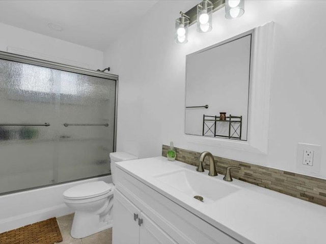 38 Nadine Ln, Port Jefferson Station, NY 11776 - bathroom featuring toilet, vanity, shower / bath combination with glass door, decorative backsplash, and tile patterned floors