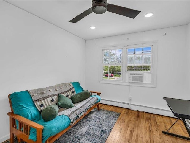38 Nadine Ln, Port Jefferson Station, NY 11776 - sitting room with baseboard heating, wood finished floors, baseboards, recessed lighting, and ceiling fan