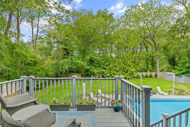 25 Cliff Rd W, Wading River, NY 11792 - wooden terrace featuring a yard, view of scattered trees, and an outdoor structure
