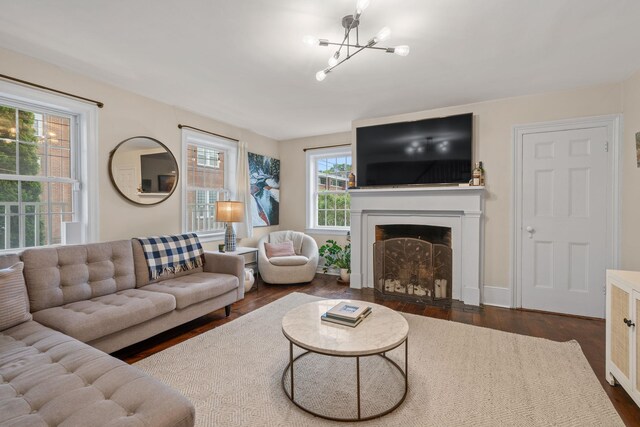 63 Liberty St, Beacon, NY 12508 - living room featuring a fireplace with flush hearth, dark wood-style flooring, and a chandelier
