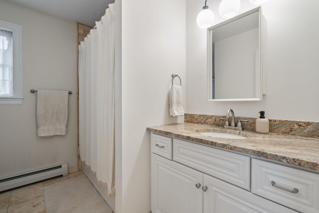 63 Liberty St, Beacon, NY 12508 - bathroom with a baseboard radiator, vanity, and curtained shower