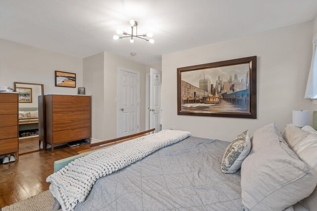 63 Liberty St, Beacon, NY 12508 - bedroom featuring a chandelier and wood finished floors