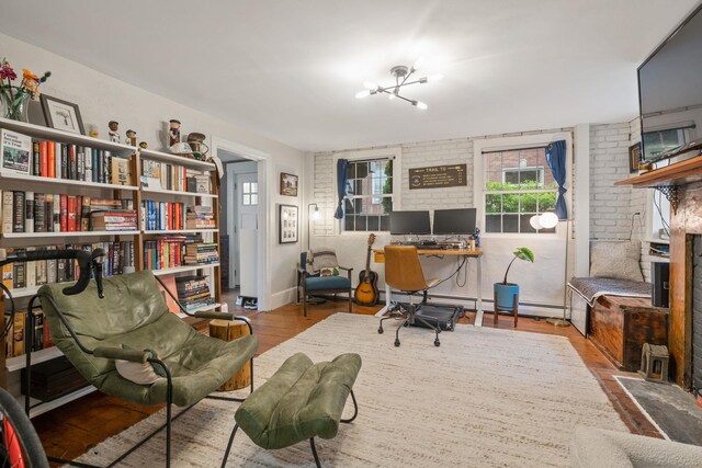 63 Liberty St, Beacon, NY 12508 - home office featuring wood finished floors and a chandelier