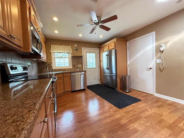 286 Berwick Ct Unit A, Ridge, NY 11961 - kitchen featuring appliances with stainless steel finishes, a sink, light wood finished floors, backsplash, and recessed lighting
