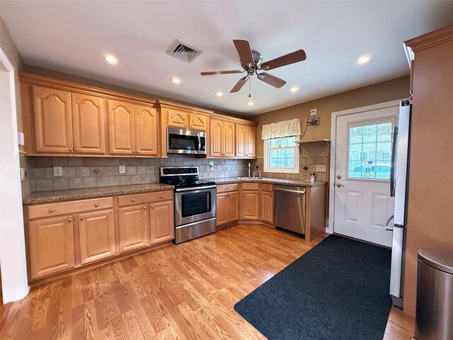 286 Berwick Ct Unit A, Ridge, NY 11961 - kitchen featuring stainless steel appliances, light wood-style flooring, ceiling fan, a sink, and recessed lighting