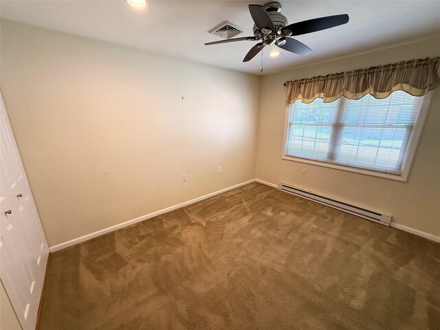 286 Berwick Ct Unit A, Ridge, NY 11961 - carpeted spare room featuring a baseboard radiator, a ceiling fan, and baseboards