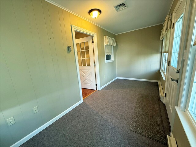 286 Berwick Ct Unit A, Ridge, NY 11961 - spare room with dark colored carpet, crown molding, and baseboards