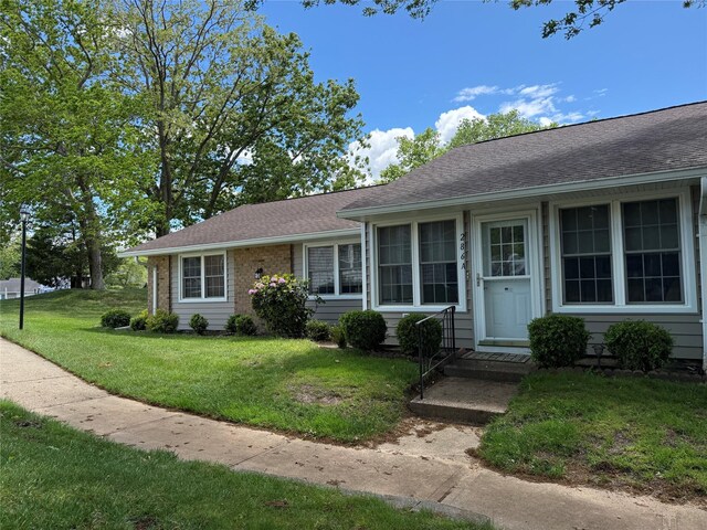 286 Berwick Ct Unit A, Ridge, NY 11961 - view of front of house featuring a front lawn and roof with shingles