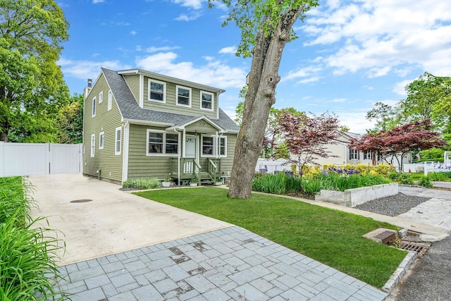 29 Montauk St, Selden, NY 11784 - bungalow with a gate, driveway, a shingled roof, and a chimney