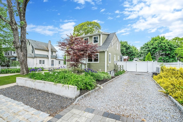 29 Montauk St, Selden, NY 11784 - view of front facade with a gate and roof with shingles